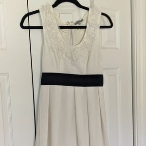 White crepe dress with black waist band